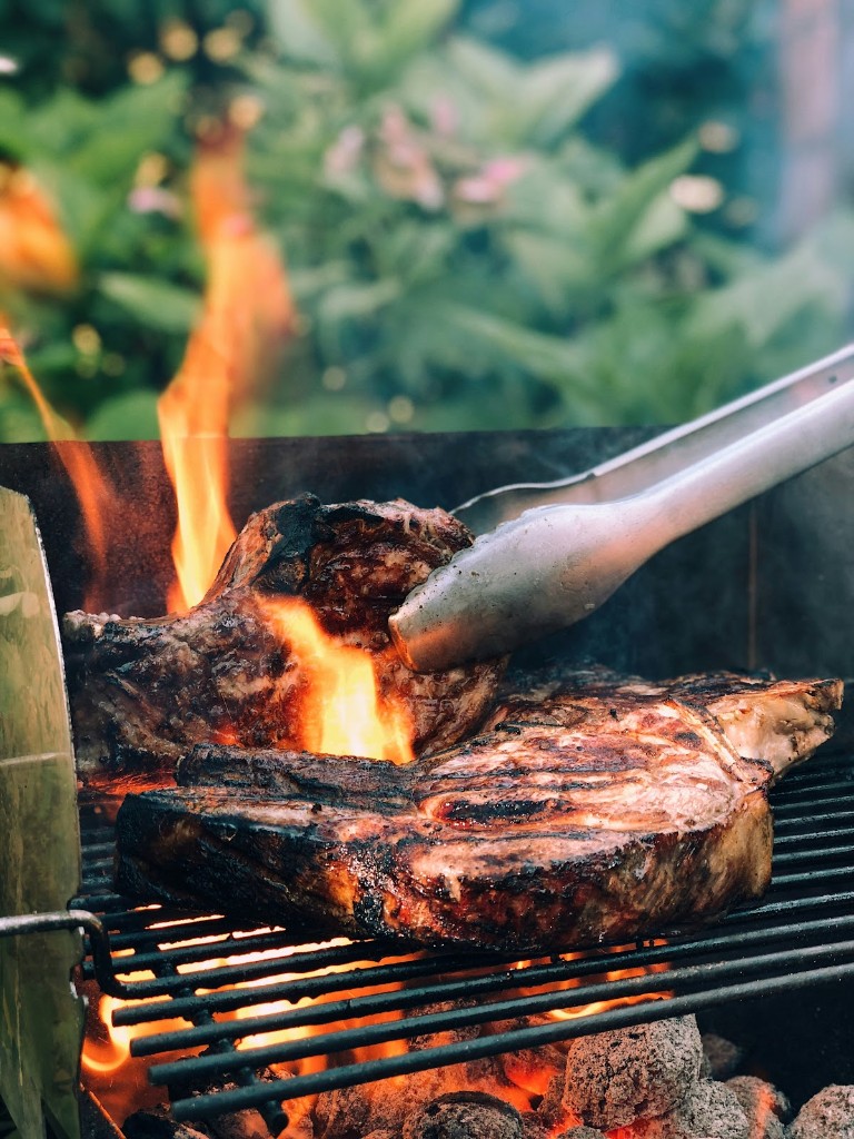 Meat grilling over an open flame